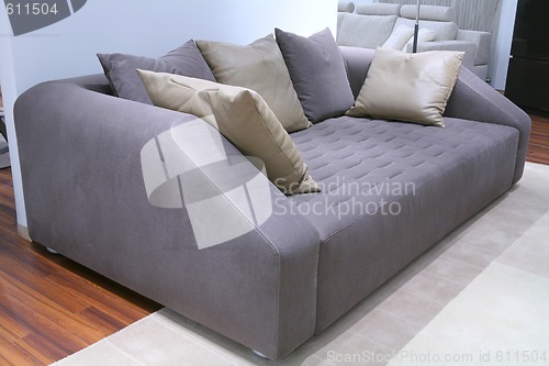 Image of sofa with leather pillow