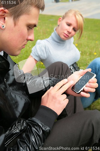 Image of girl, man and his new phone