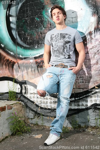 Image of lad in torn jeans