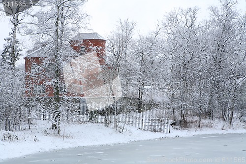 Image of winter landscape with red house