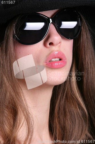 Image of white woman in the black sunglasses