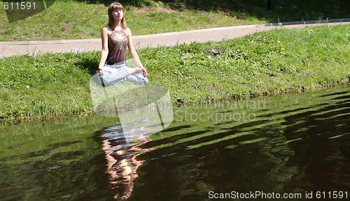 Image of beautiful girl near by water