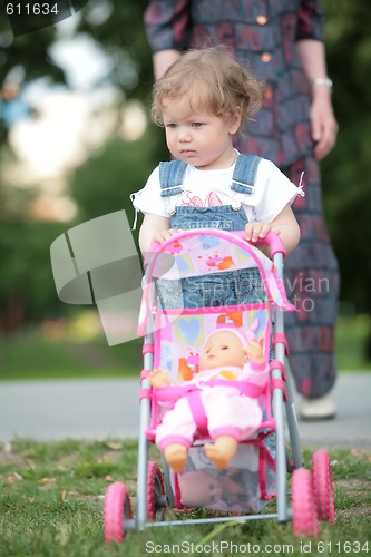 Image of little girl with doll