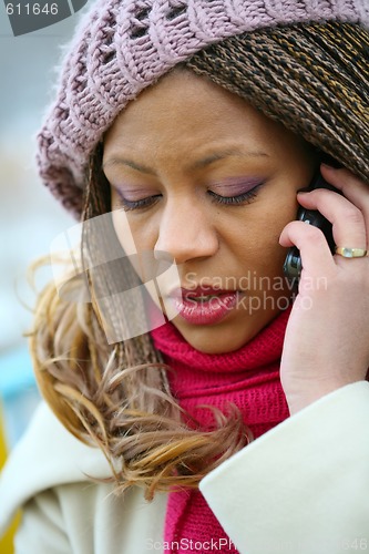 Image of girl in lilac beret with mobile phone