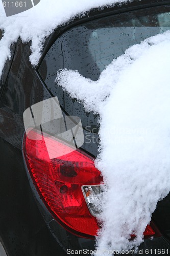 Image of car under snow