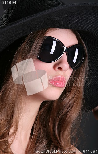 Image of black sunglasses on the woman face