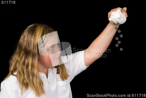 Image of Child Emptying Piggy Bank