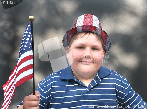 Image of Young boy waving US Flag