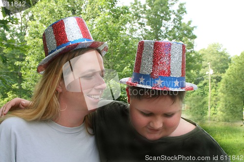 Image of Mother and son wearing 4th of july hats