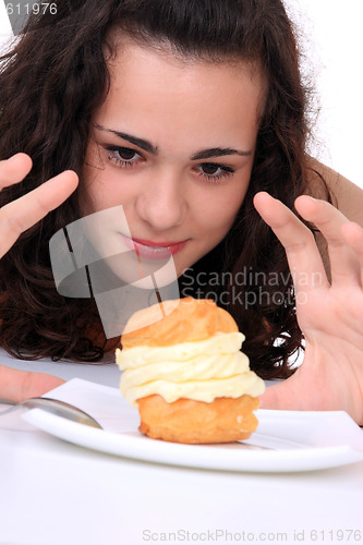 Image of Young girl eating cake