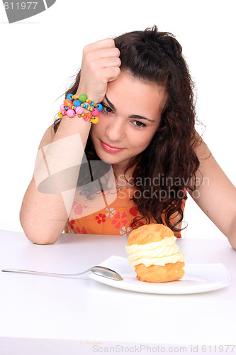 Image of Young girl eating cake