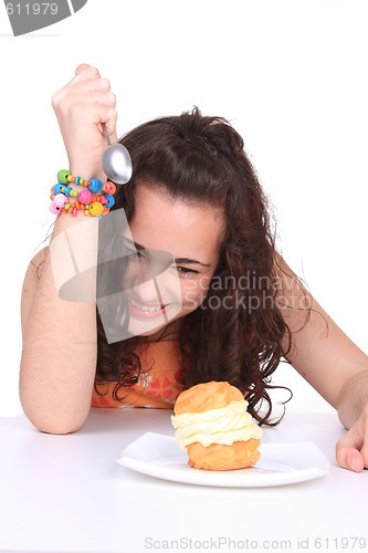 Image of Young girl eating cake
