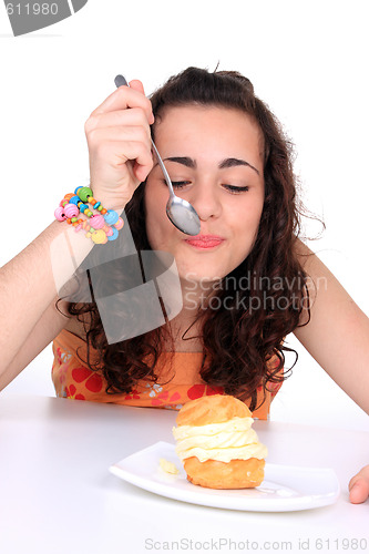 Image of Young girl eating cake