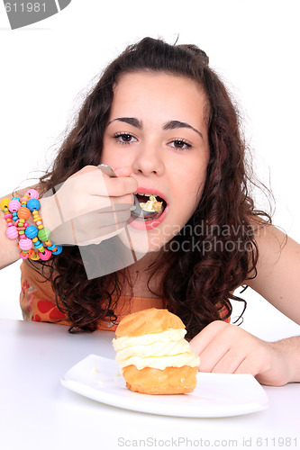 Image of Young girl eating cake