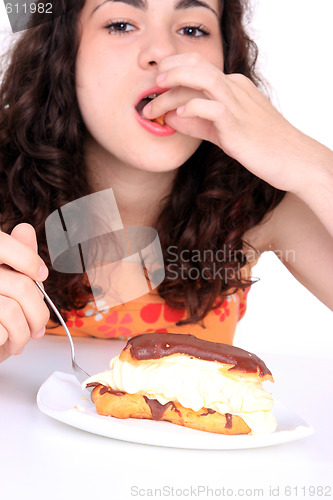 Image of Young girl eating cake