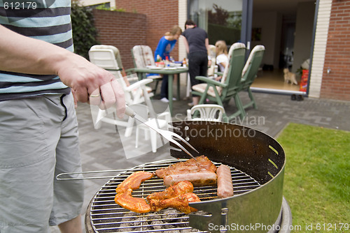 Image of Meat and kebabs on barbecue.