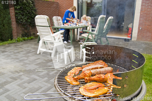 Image of Meat and kebabs on barbecue.