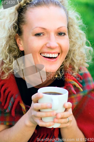 Image of woman holding a cup