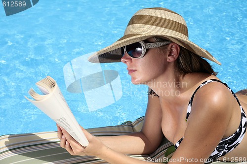 Image of Reading by the Pool