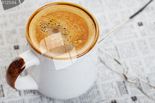 Image of Coffee on a newspaper 