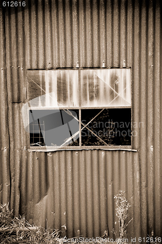 Image of old rusty metal tin shed