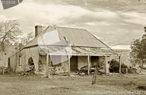 Image of old farmhouse ruins in sepia