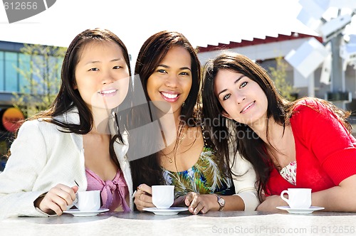 Image of Group of girlfriends having coffee