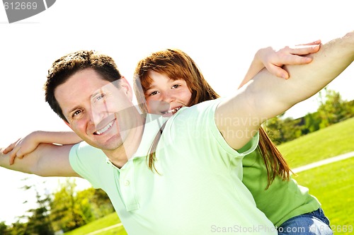 Image of Father and daughter piggyback