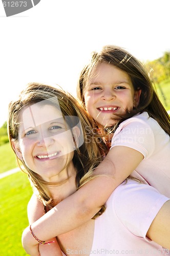 Image of Mother and daughter piggyback