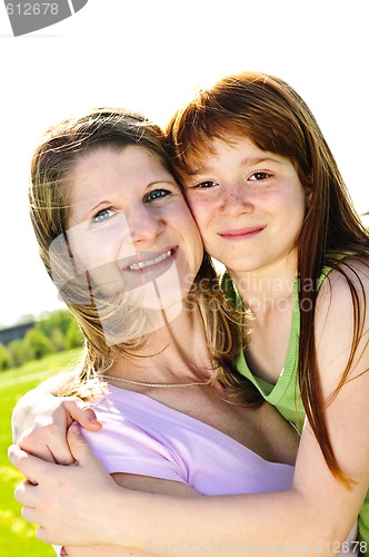 Image of Mother and daughter hugging