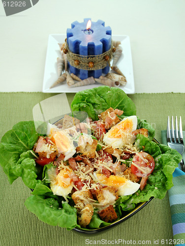 Image of Caesar Salad And Candle