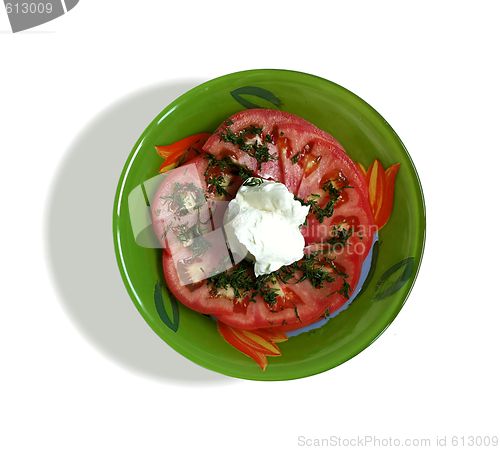 Image of Salad from a tomato with sour cream on a white background