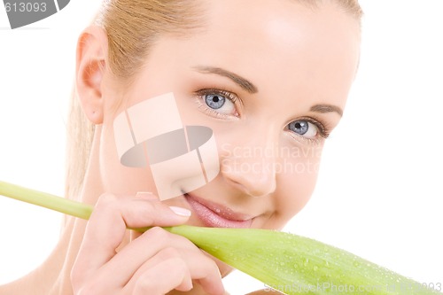 Image of happy woman with green leaf