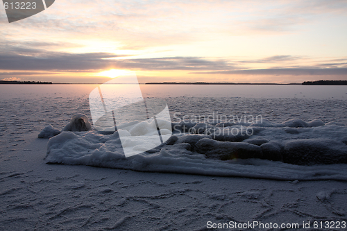 Image of Sunset over frozen lake