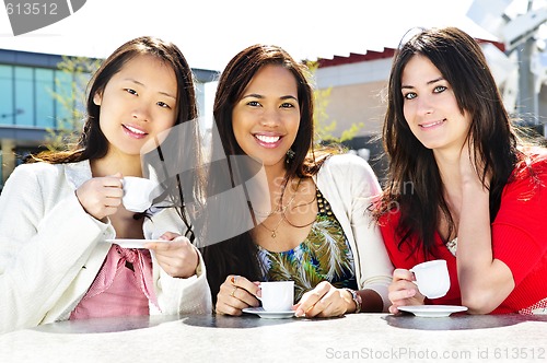 Image of Group of girlfriends having coffee