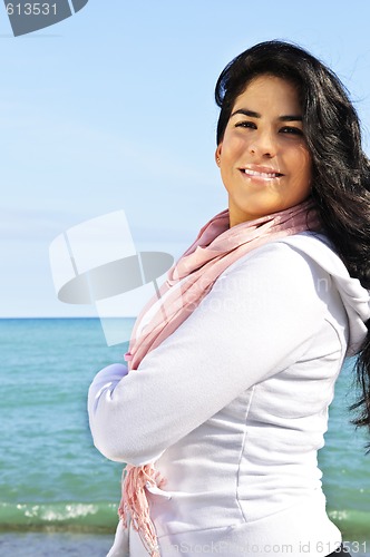 Image of Beautiful young woman at beach