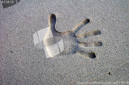 Image of sand hand punched