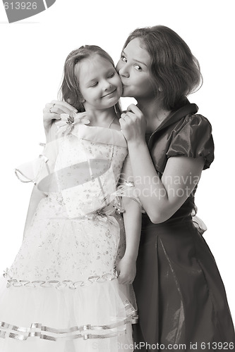 Image of mother kisses daughter