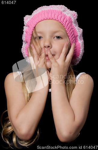 Image of Beautiful little girl with hands on face