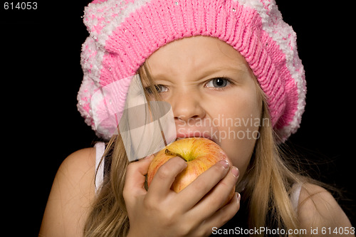 Image of little girl eating apple