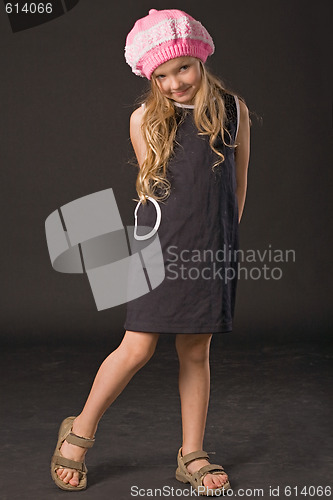 Image of shy little girl posing in studio