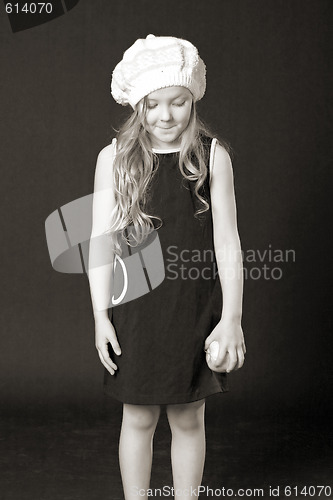 Image of sly little girl with apple