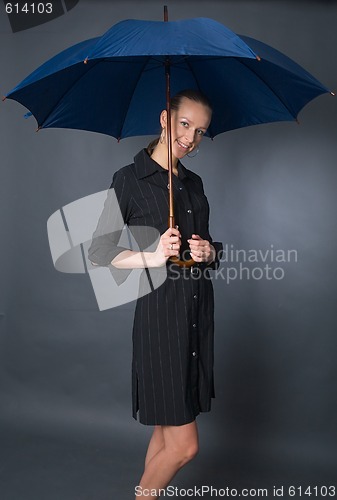 Image of young woman with umbrella