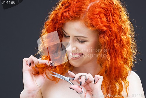 Image of redhead with scissors