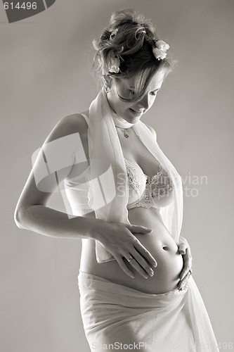 Image of beautiful pregnant woman, sepia toned