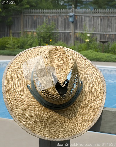 Image of Old Straw Hat And Swim Pool