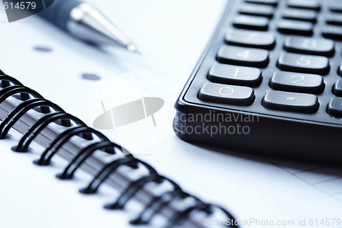 Image of Blank note pad and a calculator