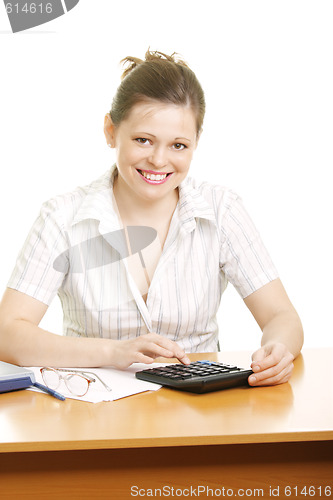 Image of Smiling businesswoman with calculator