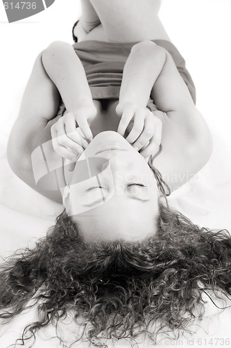 Image of dreamy girl lying on a floor