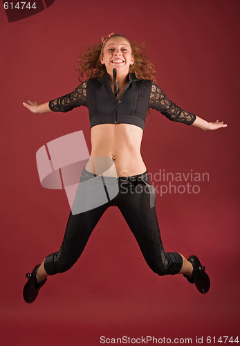 Image of beautiful girl jumping